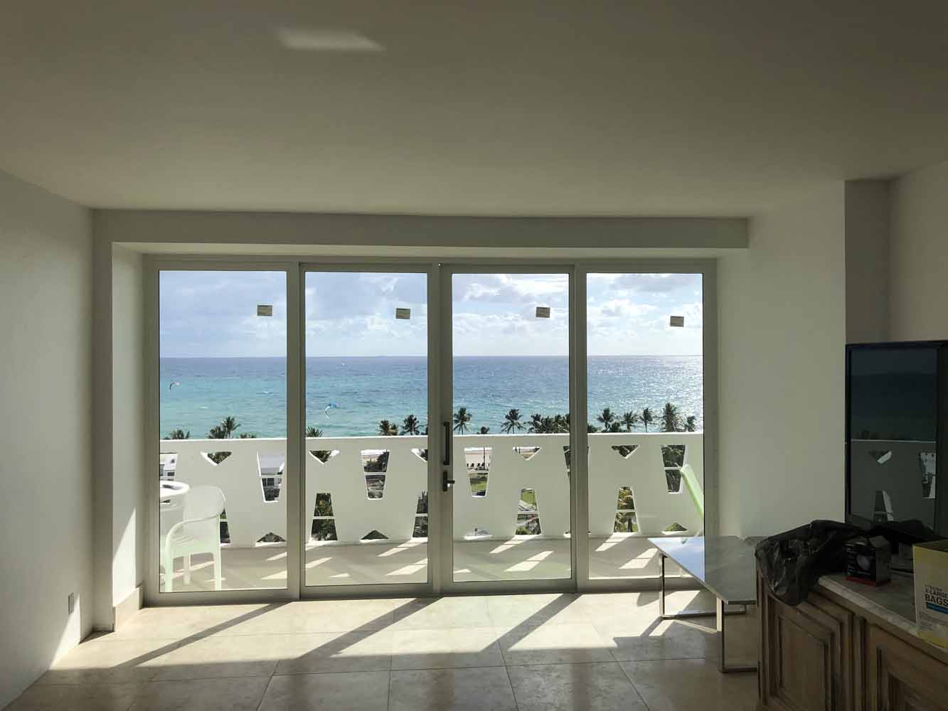 (A1) Beach Condo_Living Room_SIW Impact Sliding Glass Doors