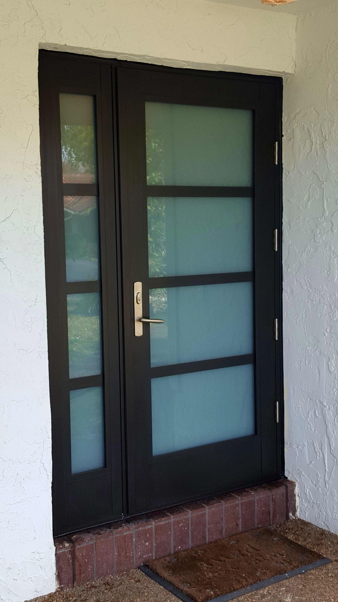 SIW Impact French Doors_ Job B 1 caption_ SIW Impact French Door with Sidelight and Mutins_White Privacy Innerlayer_Outside View