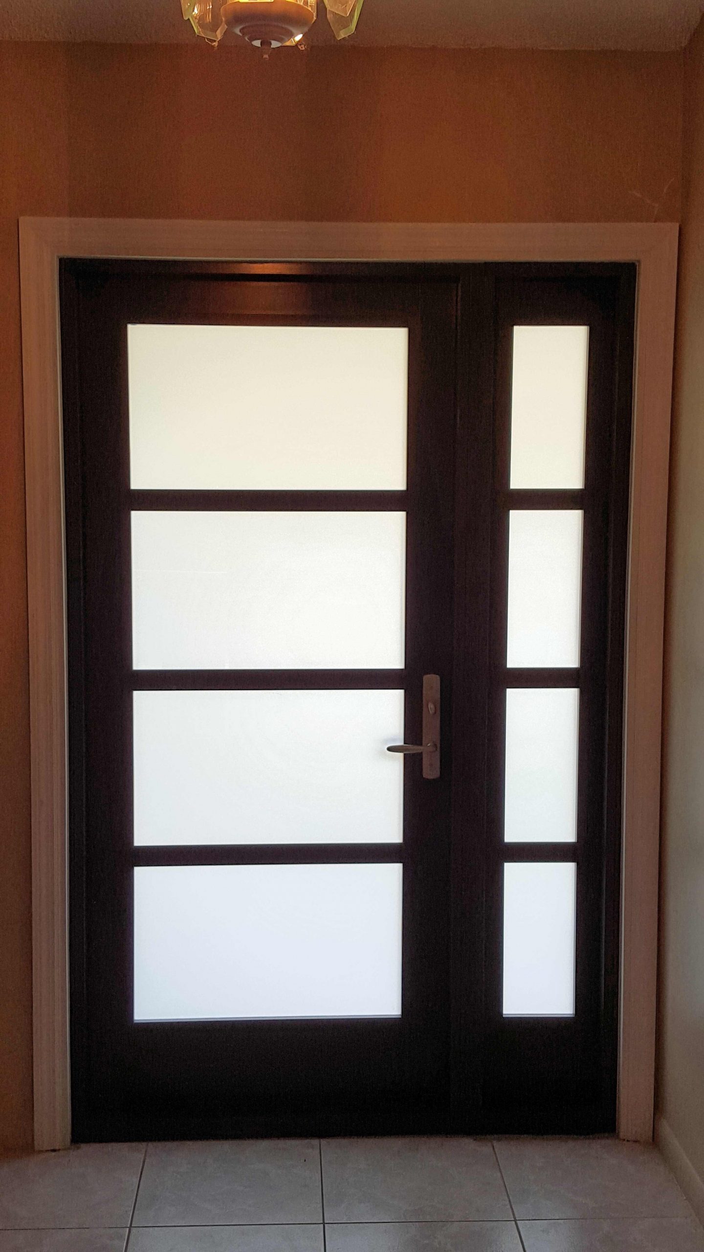 SIW Impact French Doors_ Job B 2 caption_ SIW Impact French Door with Sidelight and Mutins_White Privacy Innerlayer_Inside View